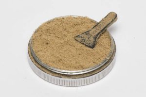 Isolated cannabis kief in a white background