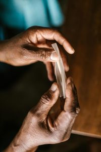 Someone holding a rolling paper