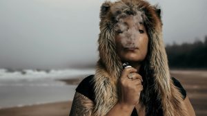 lady vaping on beach
