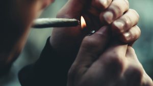 A man smoking a blunt