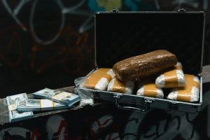 Money on table and drugs in the briefcase