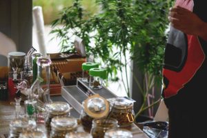 Different types of cannabis buds in a glass jar, medicinal marijuana