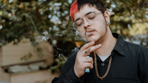 a man smoking cannabis