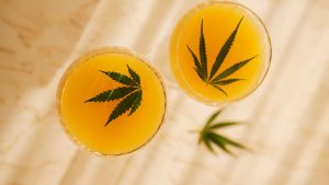 two glasses of moctail with cannabis leaf