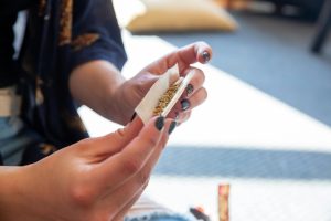 someone getting ready to smoke a strain