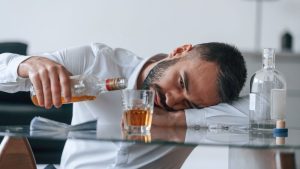 Man drinking. Alcoholism