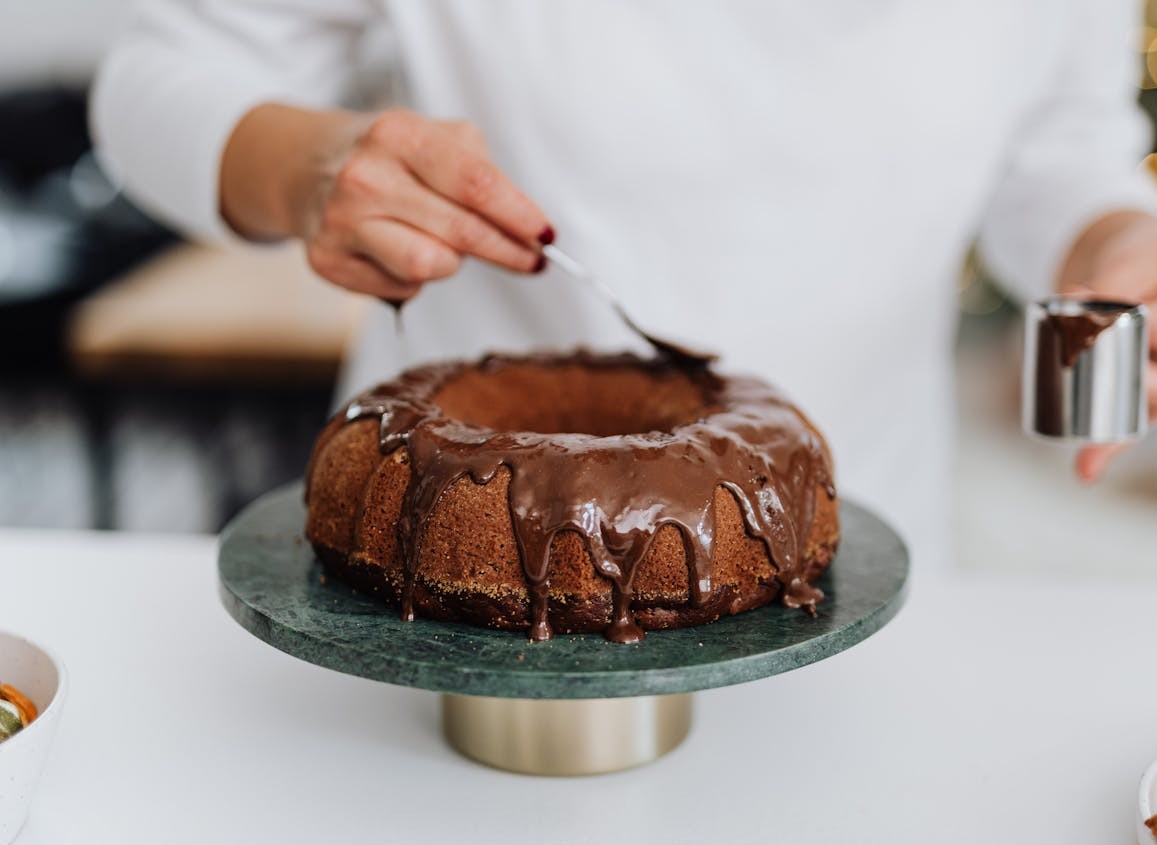 space cake bundt cake being frosted 