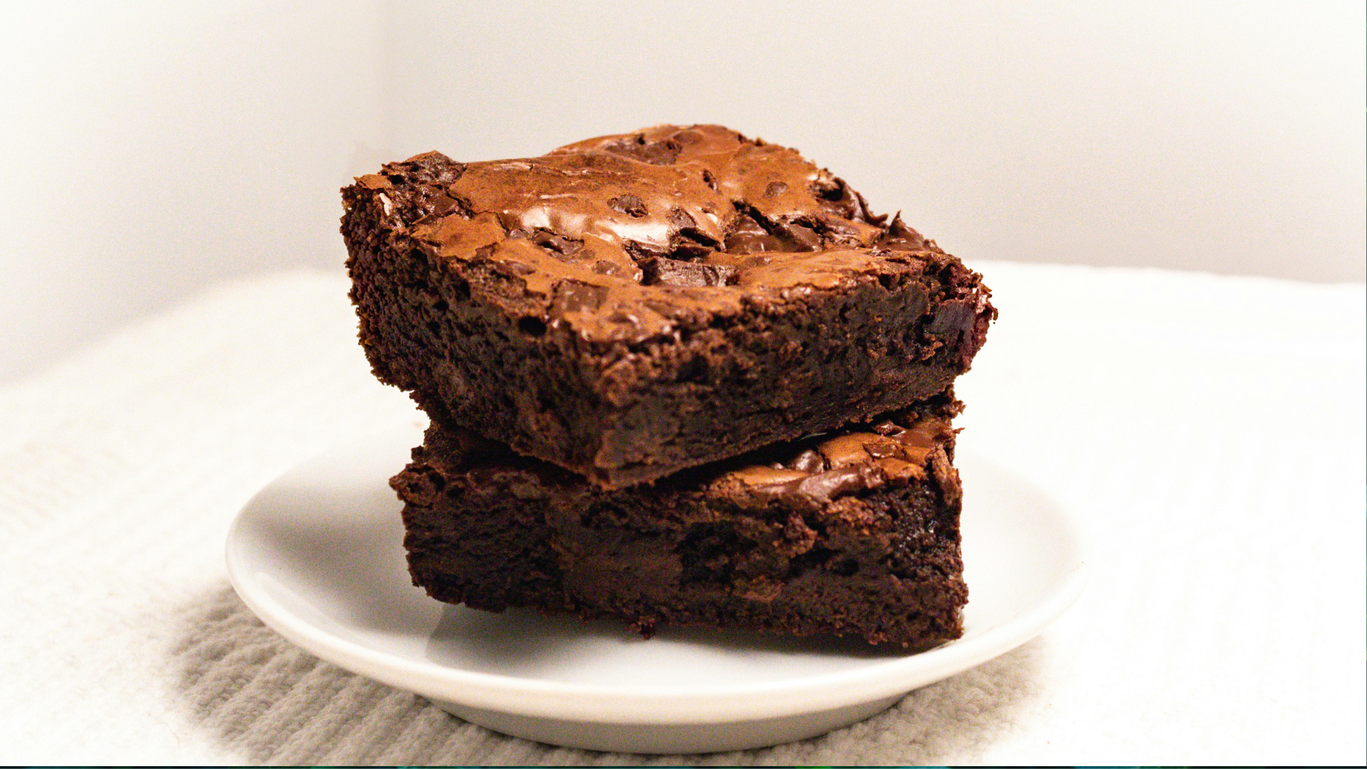 brownies on a white plate for safe edible consumption guide